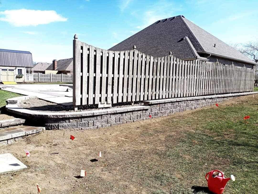 Image of a residential landscaping project in Indianapolis, showing the dramatic improvement and beautification of a home's outdoor space.
