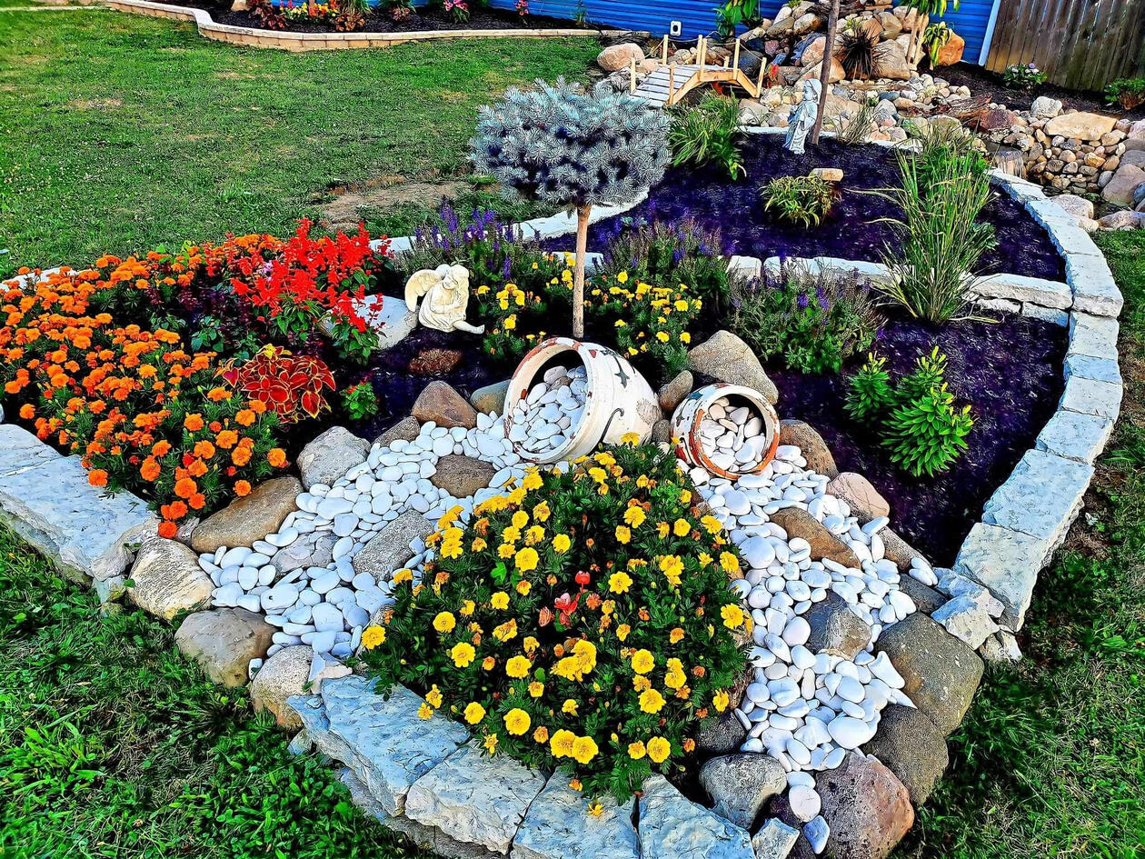 Custom floral designed in an residential backyard in Indianapolis showcasing local flower and custom stone trim.