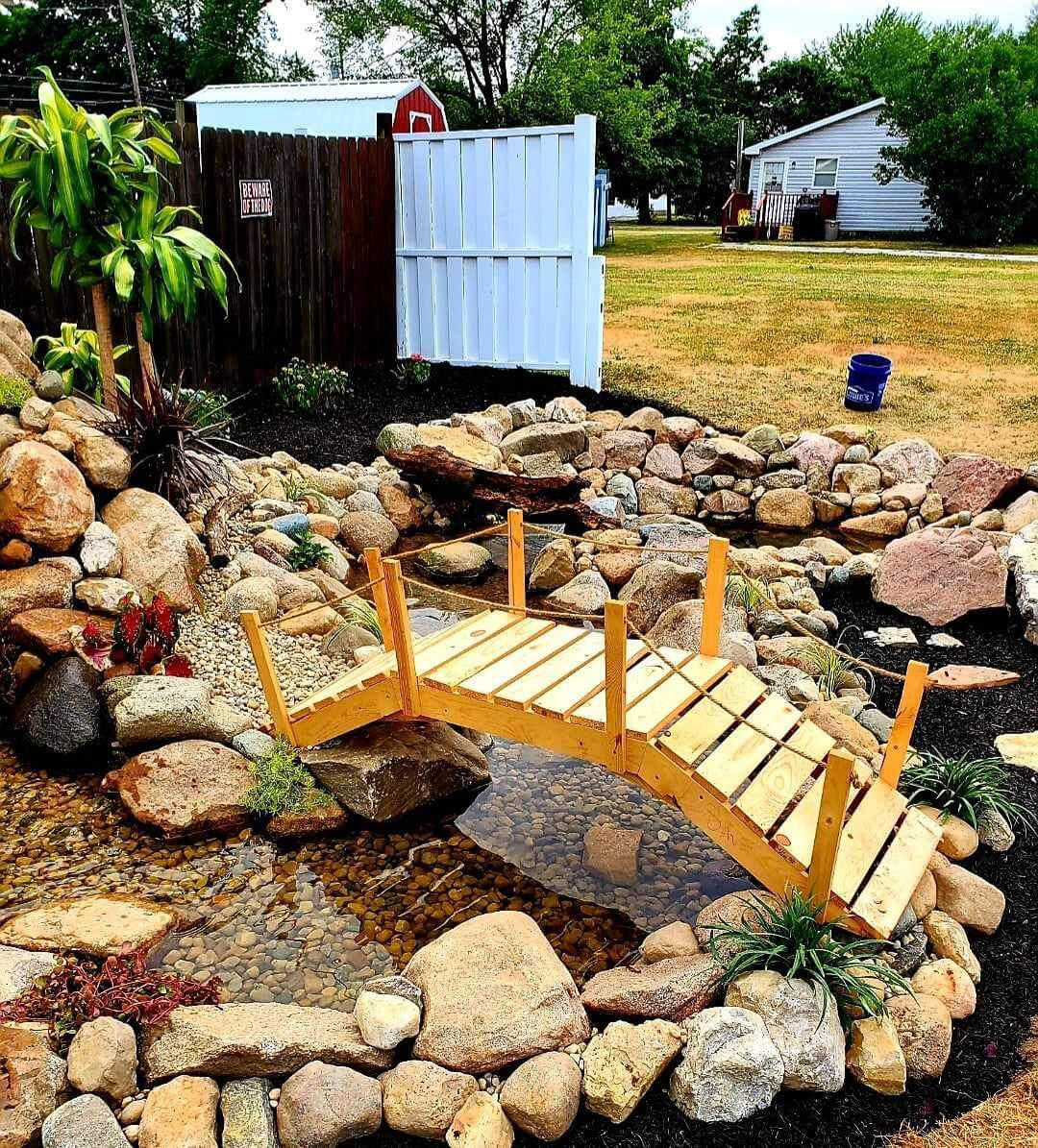 Impressive display of mulching around a tranquil water feature in an Indianapolis backyard.